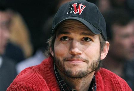 Ashton Kutcher sits courtside during the Los Angeles Lakers against Denver Nuggets NBA playoff game in Los Angeles