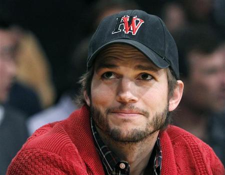 Ashton Kutcher sits courtside during the Los Angeles Lakers against Denver Nuggets NBA playoff game in Los Angeles