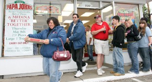 People leave Papa John's in Cleveland with pizza for 23 cents