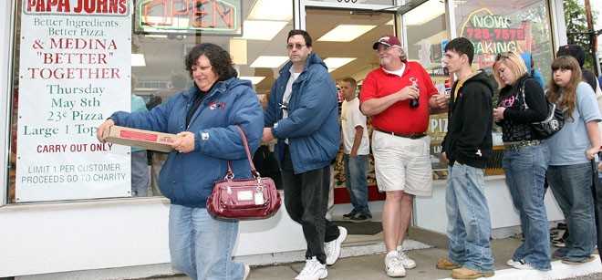 People leave Papa John's in Cleveland with pizza for 23 cents