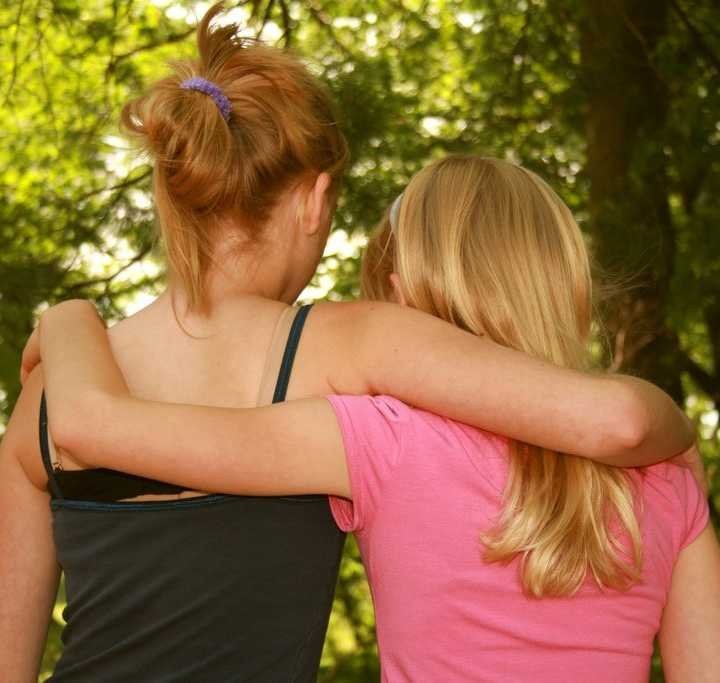 teen GIRLS hugging
