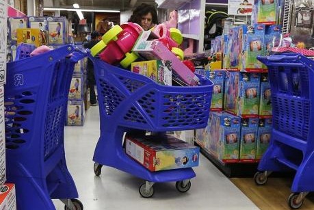 File of a woman shopping at a Toy R Us store in Carle Place, New York