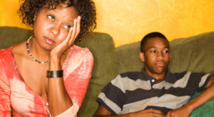 Worried African-american Woman Sitting With Teen