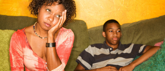 Worried African-american Woman Sitting With Teen