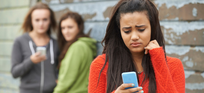 Teenage Girl Being Bullied By Text Message