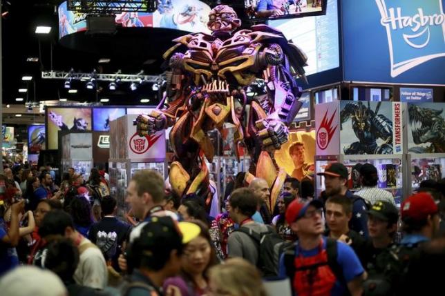 A Transformers statue stands on display at the Hasbro booth during the 2014 Comic-Con International Convention in San Diego