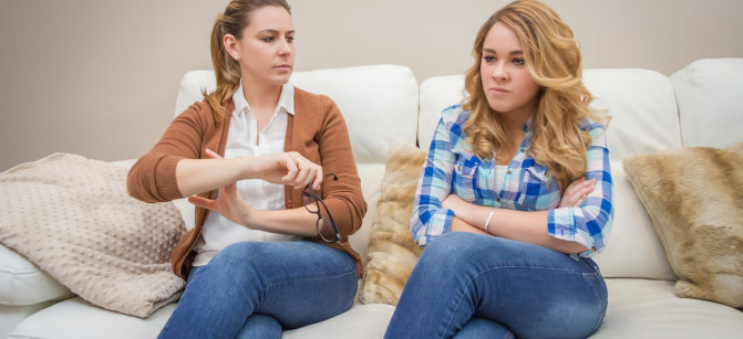 Furious mother arguing with her ​​teenage daughter