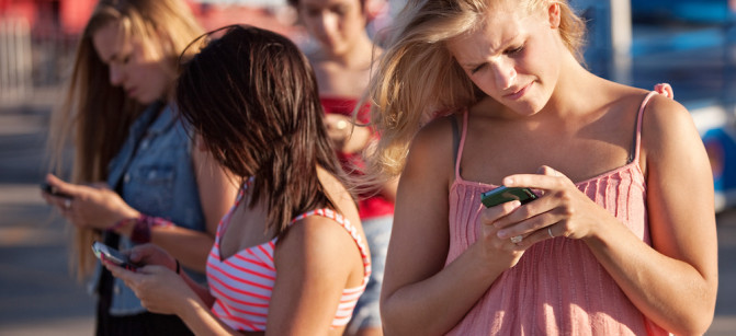 Serious Teenagers on Smartphones