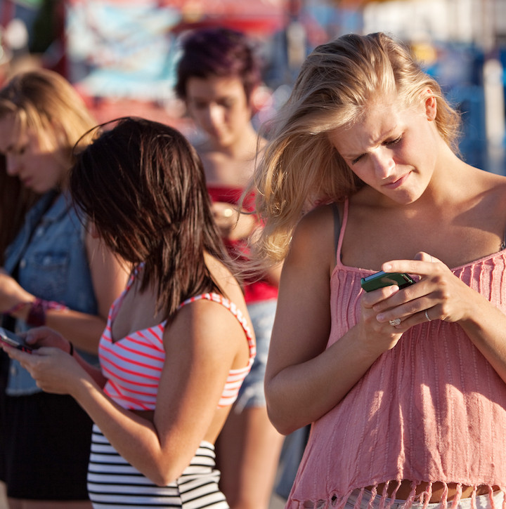 Serious Teenagers on Smartphones