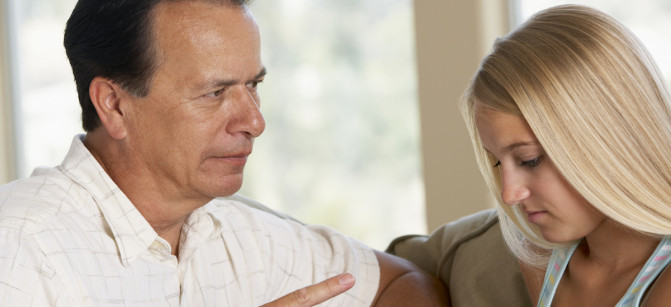 Man Having A Serious Talk With His Daughter