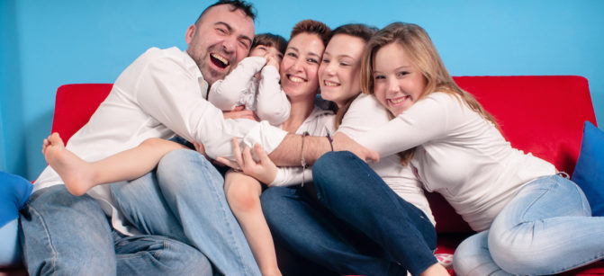 happy family on the couch in the living room