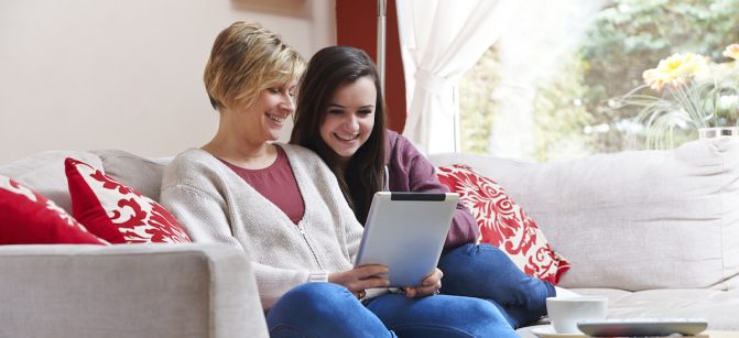 Mother and daughter on tablet computer