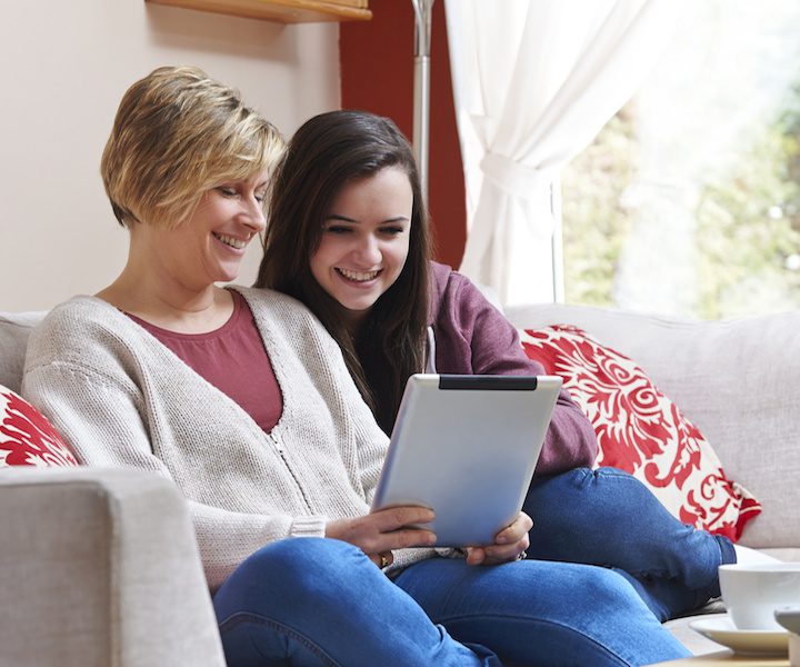 Mother and daughter on tablet computer