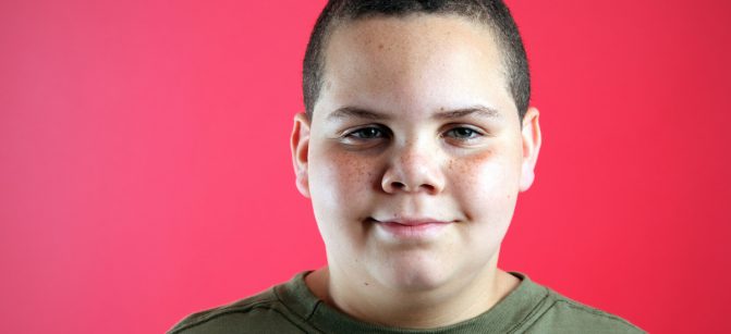 Happy boy smiling studio portrait