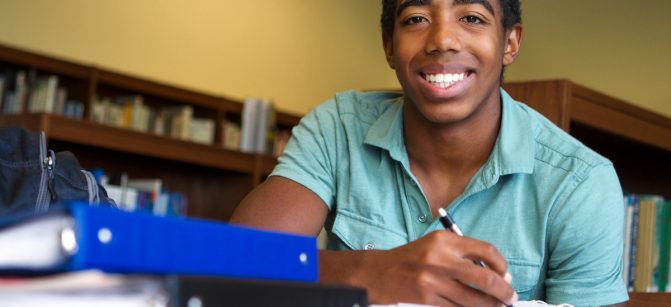 Black teenager studying school smile