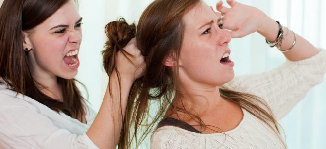 Sisters having an argument and getting physical with a fight.