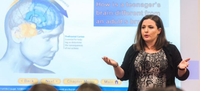Dr. Courtney Harkins, a clinical supervisor at Jserra Catholic High gives a presentation to Jserra students about suicide, depression, how to recognize the symptoms and what to do about it in San Juan Capistrano on Wednesday, Feb. 28, 2018. (Photo by Leonard Ortiz, Orange County Register/SCNG)