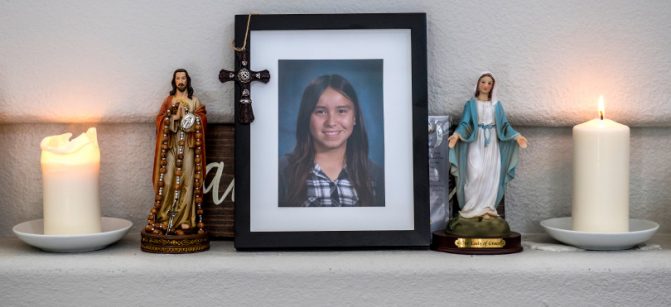 With candles lit, a photograph Emma Pangelinan sits on the mantle in the living room of her home in Mission Viejo on Friday, March 16, 2018. Emma, who at 13 years old, killed herself in January.  (Photo by Mark Rightmire, Orange County Register/SCNG)