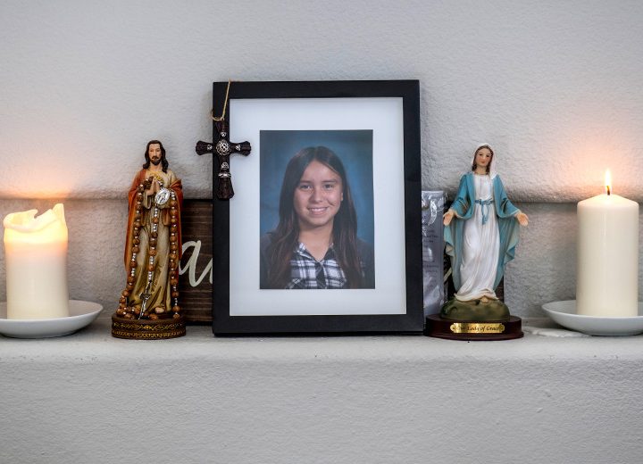 With candles lit, a photograph Emma Pangelinan sits on the mantle in the living room of her home in Mission Viejo on Friday, March 16, 2018. Emma, who at 13 years old, killed herself in January.  (Photo by Mark Rightmire, Orange County Register/SCNG)