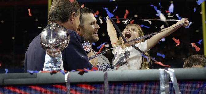 New England Patriots' Tom Brady holds his daughter Vivian, after the NFL Super Bowl 53 football game against the Los Angeles Rams, Sunday, Feb. 3, 2019, in Atlanta. The Patriots won 13-3. (AP Photo/Carolyn Kaster) ORG XMIT: NFL