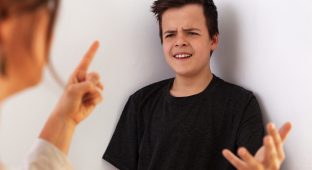 Woman having a fight with her teenager son - gesturing and expressing disagreement with each other