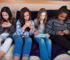 Cell scream Group of kids on their mobile device